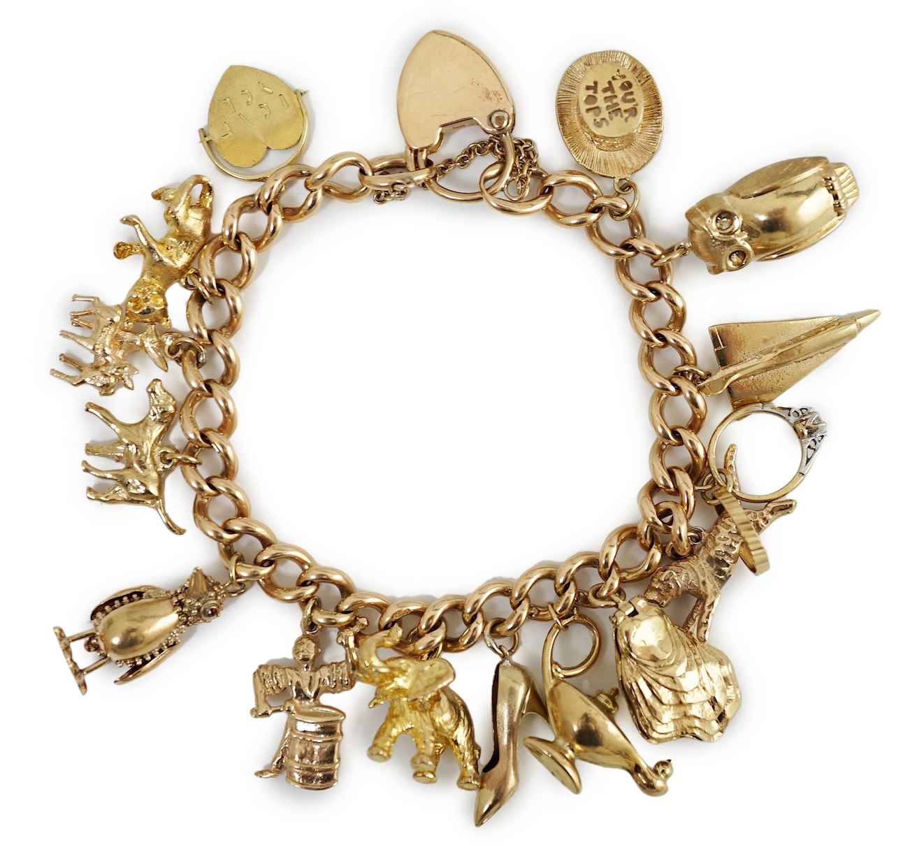 An early 20th century 15ct gold curb link charm bracelet